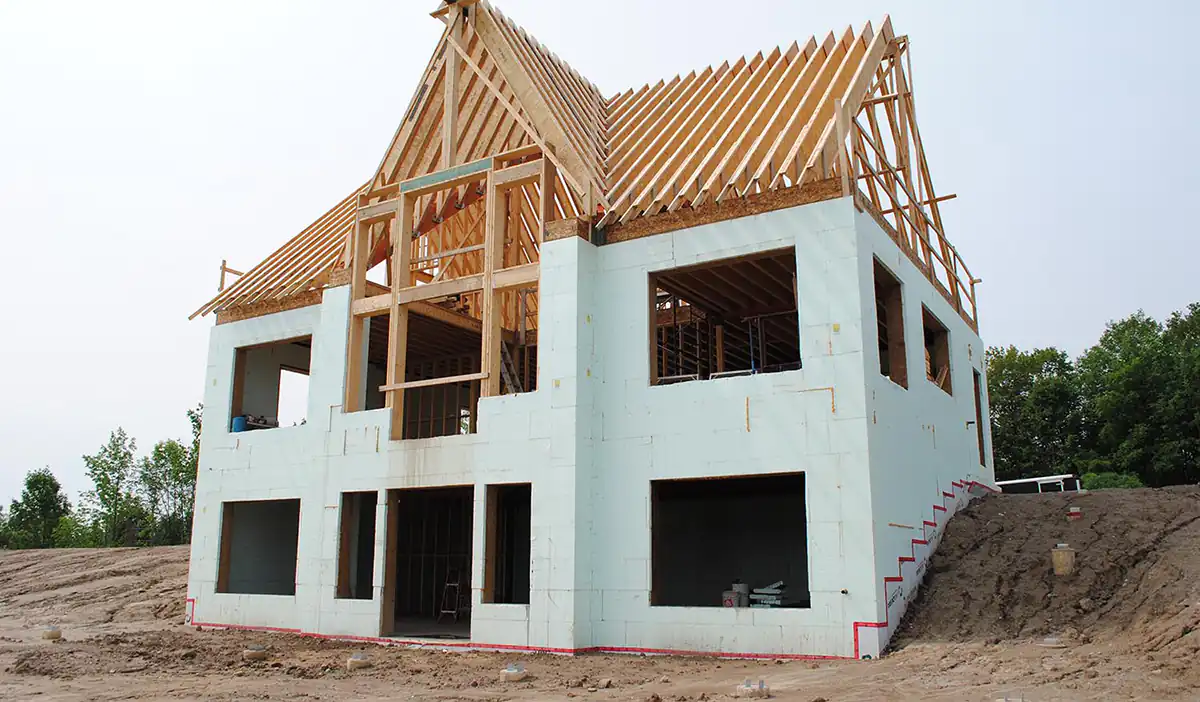 ICF Construction - Worker installing insulated concrete formwork panels